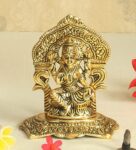 Antique Golden Aluminium Goddess Saraswati Seated On Her Throne Carved In Antique Golden Finish Idol