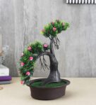 Green Plastic and Polyester Blend Artificial Shoe Horn Shaped Bonsai Tree with Bushy Green Leaves and Small Pink Flowers