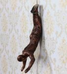 Polyresin Hanging Position Wall Art In Brown