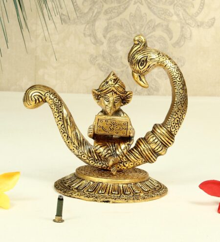 Antique Golden Aluminium Metal Lord Ganesha Reading Ramayana Statue Seated On Peacock Idol